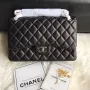Chanel CF A01113 Jumbo Classic Flap Bag v černé barvě z jehněčí kůže, stříbrná