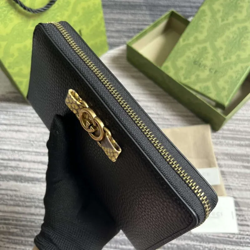 Gucci 750458 Zip peněženka s propleteným G pythonovým mašlí černá
