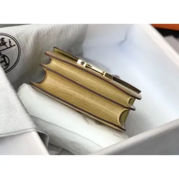 Kabelka Hermes Constance 18 cm v barvě Jaune Poussin s embosovaným krokodýlem