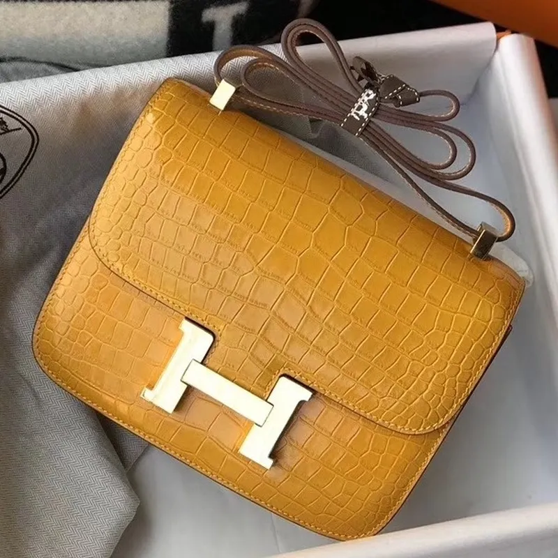 Kabelka Hermes Constance 24cm v žluté embosované krokodýlí kůži