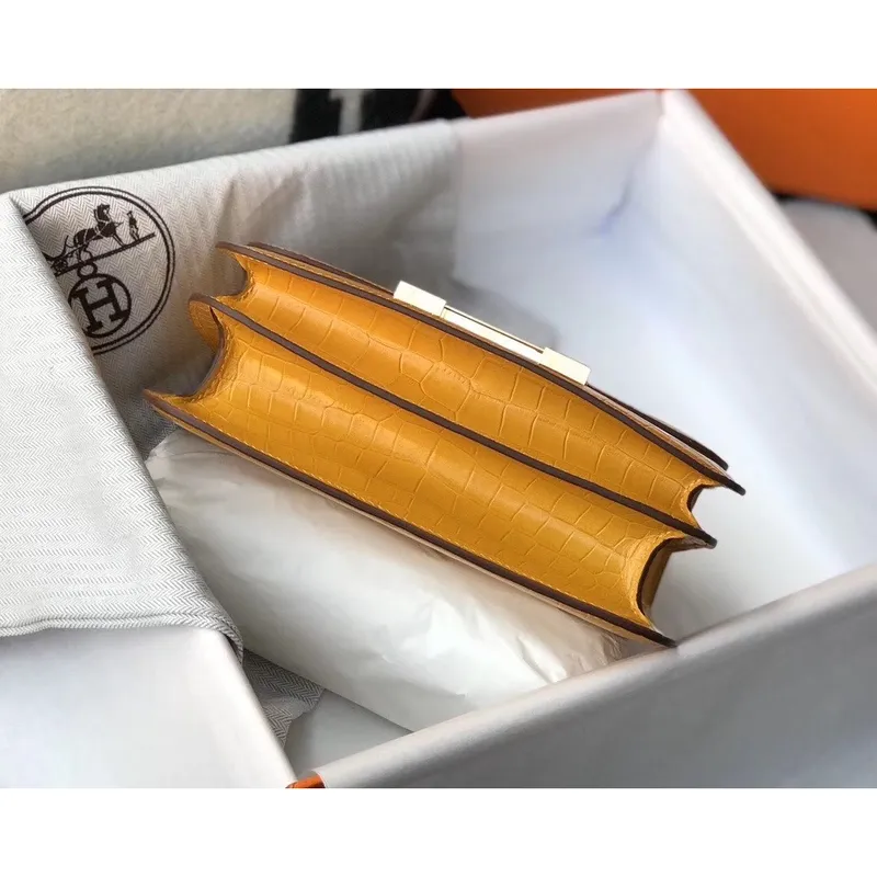 Kabelka Hermes Constance 24cm v žluté embosované krokodýlí kůži