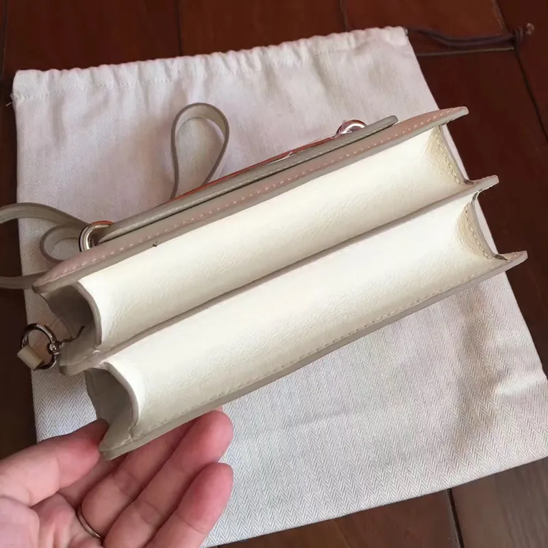 Hermes Mini Sac Roulis taška v krémové kůži Swift