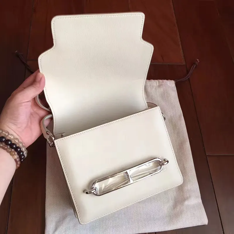 Hermes Mini Sac Roulis taška v krémové kůži Swift